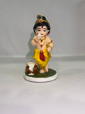 Captures the classic, beloved "Makhan Chor" pose—complete with the traditional pot of butter (matki), flute, and peacock feather crown.