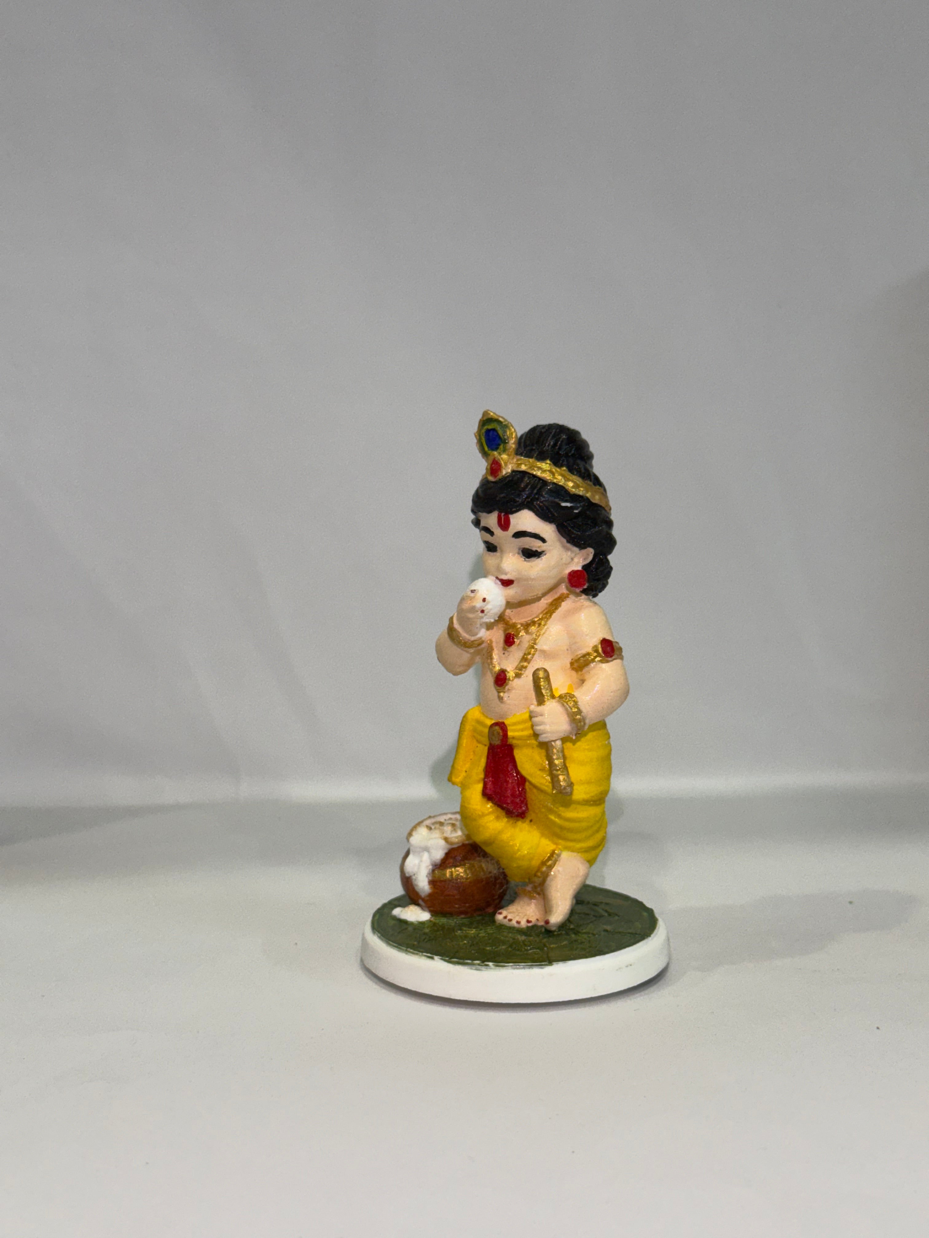 Captures the classic, beloved "Makhan Chor" pose—complete with the traditional pot of butter (matki), flute, and peacock feather crown.